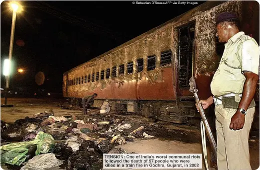  ?? © Sebastian D’Souza/AFP via Getty Images ?? TENSION: ONE OF INDIA’S WORST COMMUNAL RIOTS FOLLOWED THE DEATH OF 57 PEOPLE WHO WERE KILLED IN A TRAIN FIRE IN GODHRA, GUJARAT, IN 2002