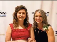  ?? / Alexis Draut ?? Erica and Caroline pose for a picture at Friday’s Night to Shine event at First Baptist Church, which was sponsored by the Tim Tebow Foundation.