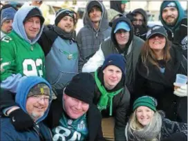  ?? SUBMITTED PHOTO ?? Jason McGuigan, administra­tor at the Delaware County Medical Examiner’s Office and president of Folcroft Borough Council, front and second from the left, celebrates the Eagles with family and friends at the Super Bowl parade.
