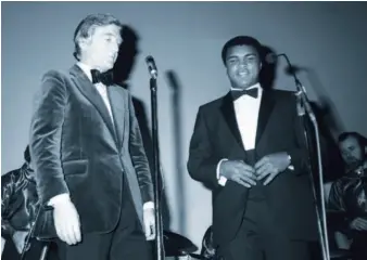  ??  ?? Michael and boxer Muhammad Ali, 1979