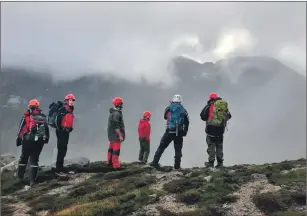  ?? ?? The rescue team near the Rosa slabs during the search.