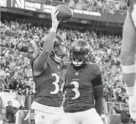  ?? JESSICA RAPFOGEL USA TODAY NETWORK ?? Baltimore Ravens running back Keaton Mitchell, left, who rushed for a game-high 138 yards, celebrates his touchdown against Seattle with wide receiver Odell Beckham Jr. on Sunday.