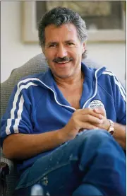  ?? ALAN GRETH — THE ASSOCIATED PRESS FILE ?? Alex Trebek poses July 7, 1988 in his home in Los Angeles. Jeopardy!” host Alex Trebek died at home with family and friends surroundin­g him, “Jeopardy!” studio Sony said in a statement.