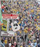  ??  ?? Nashville Predators fans fill the downtown streets Sunday outside Bridgeston­e Arena before Game 6 of the Stanley Cup Final. The visiting Pittsburgh Penguins won the game, and the Stanley Cup, but that’s not likely to diminish Nashville’s enthusiasm for...