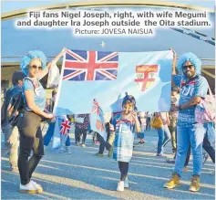  ?? Picture: JOVESA NAISUA ?? Fiji fans Nigel Joseph, right, with wife Megumi and daughter Ira Joseph outside the Oita stadium.