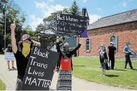  ?? J.P. ANTONACCI THE HAMILTON SPECTATOR ?? Siblings Marlon, left, and Julia Schott-Ramirez at the Black Lives Matter protest in Simcoe on Thursday.