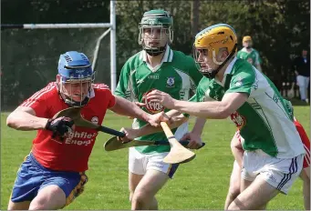  ??  ?? Mark Boland of Tara Rocks is confronted by Darren Carty (Taghmon-Camross).