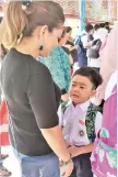  ??  ?? Ivan Hazael looks forlornly at his mom during his first day as a Primary one pupil.