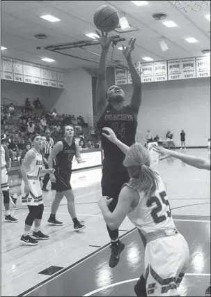  ?? The Sentinel-Record/James Leigh ?? LEADING LADY: Ouachita Baptist’s Shakyla Begnaud takes a shot over Henderson State’s Lani Snowden in Tuesday’s Battle of the Ravine at the Duke Wells Center at HSU. The sophomore Tiger from McGehee picked up her first career double-double and set a...