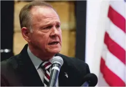  ?? | AP ?? U. S. Senate candidate RoyMoore has denied an Alabama woman’s allegation that Moore made inappropri­ate advances and had sexual contact with her when she was 14.