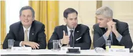  ?? SUSANWALSH/AP ?? Sen. Marco Rubio, center, flanked by Sen. Steve Daines, R-Mont., left, and Sen. R-La., talk as they wait for President Donald Trump at Tuesday’s meeting. Bill Cassidy,