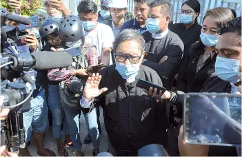  ?? — AFP photo ?? Khin Maung Zaw speaks to the media outside Dekhina district court in Naypyidaw.