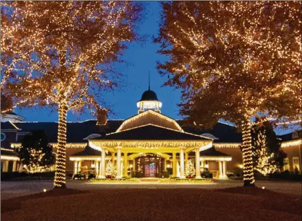  ?? PHOTOS COURTESY OF VISIT LAKE OCONEE ?? The Ritz-Carlton Reynolds, Lake Oconee’s Christmas capital, features the Winter Forest, an immersive environmen­t where you’ll discover a 5,000-square-foot ice skating rink, the swanky Ice Lounge and the Sand Bar.