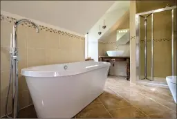  ??  ?? A lavish family bathroom was created during the refit