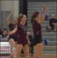  ?? PETE BANNAN – DIGITAL FIRST MEDIA ?? Garnet Valley’s Dolce Whitwell, left, Gwen Clark, middle and Ally Hartney celebrate a point in the Jaguars’ first game of their PIAA playoff win over Emmaus.
