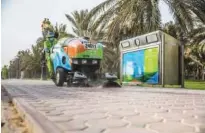  ??  ?? Bee’ah vehicle and a three-stream bin along a roadside in Sharjah.