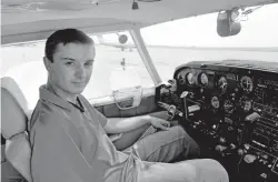  ?? DEJANAY BOOTH/CARLSBAD CURRENT-ARGUS VIA AP ?? Payson Norton in the cockpit of a Piper Comanche PA24 aircraft last week at the Cavern City Air Terminal in Carlsbad. Norton, 16, flew his aircraft solo for the first time Friday.