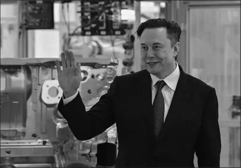  ?? PATRICK PLEUL / POOL VIA AP ?? Tesla CEO Elon Musk attends the opening of a Tesla factory March 22 in Gruenheide, Germany.