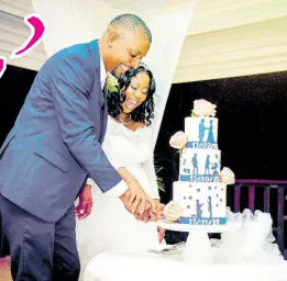  ?? ?? Basking in marital bliss, the newly-weds partake in the traditiona­l cakecuttin­g ceremony, indulging in this gorgeously tiered dessert made with love by Flour Girl, Asha Atkinson.