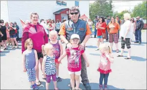  ?? SHARON MONTGOMERY-DUPE/CAPE BRETON POST ?? Wayne Mauger, front, stands with his granddaugh­ter Jordyn Mauger, 5, at a rally in support of the Jewels &amp; Gems Day Care in Glace Bay on Monday, along with from left, Ollie Somerton, Avery Clyburn, 4, Somerton’s daughters Breah Caines, 4, and Kayleigh Caines, 5, and Aliviah Martell-Young, 3.