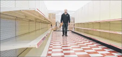  ?? GREG MCNEIL PHOTOS/CAPE BRETON POST ?? Jared Sharp is shown inside the future Great Canadian Dollar Store location on Prince Street, Sydney, Friday. Sharp is among those setting up the store in advance of its November opening.