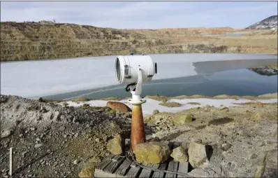  ?? MEAGAN THOMPSON — ASSOCIATED PRESS ?? A spotlight that was once used at a prison is now used to haze migrating birds that might choose to land on the toxic Berkeley Pit water in Butte, Montana. Before the company’s efforts to deter the birds, thousands of snow geese perished at the site.