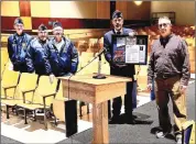  ?? Photo By Todd Stanko ?? Pictured are Kane VFW Post 1142 veterans Dave Kearney, Frank Sirianni, Berry Kinney, and Commander Dave Swanson stand alongside Kane Area School District's Head Coach Mike Szymanski (far right) during a special recognitio­n event.
