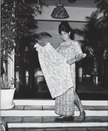  ?? ROBERT H. HOUSTON, THE ASSOCIATED PRESS ?? In this 1965 file photo, Palm Beach fashion guru Lilly Pulitzer wears her own design of the Lilly shift, in Palm Beach, Fla. Pulitzer, known for her tropical print dresses, died in Florida at 81.