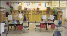  ?? H John Voorhees III / Hearst Connecticu­t Media ?? A classroom gets ready this past summer to welcome students to the new school year.