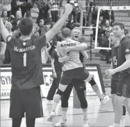  ?? JOHN RENNISON, THE HAMILTON SPECTATOR ?? Jordan Pereira, back to camera, and Andrew Richards, both centre, embrace as the McMaster Marauders downed the Long Beach State 49ers Saturday night at McMaster University three games to two in volleyball.