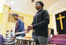  ?? STAFF PHOTO BY ERIN O. SMITH ?? Kaleb McNary, 13, and Khandrel Perry, 14, practice with the Unity Performing Arts Foundation at Grace Pointe Church. The group will participat­e in a concert tonight to celebrate Black History Month.