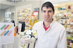  ?? AFP ?? Toni Dovale poses with a ball at his family’s pharmacy in La Coruna.