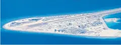  ?? PHOTOS BY AP ?? BELOW An airstrip, structures and buildings on China’s man-made Subi Reef in the Spratly chain of islands in the South China Sea are seen from a Philippine Air Force C-130 transport plane.