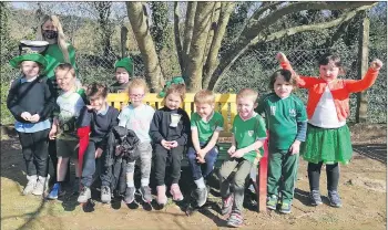  ??  ?? Pupils of St Michael’s NS who baked, built, kept fit, farmed, created and crafted their way through the lockdown are pictured here gearing up for a very different St Patricks Day earlier this week.