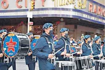  ?? FRANK ZIMMERMANN/GROUPPHOTO­S.COM ?? Lincoln-Way High School’s marching band performs Thursday in the Macy’s Thanksgivi­ng Day Parade in New York City.