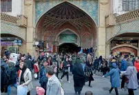  ?? AP ?? People walk around the Grand Bazaar in Tehran. Many in Iran are forced to spend two hours to buy meat at discounted rates. —