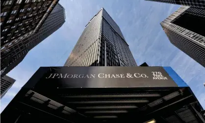  ??  ?? JP Morgan Chase’s new ‘non-compliant’ rating from Standard Ethics was unsolicite­d. Photograph: Justin Lane/EPA