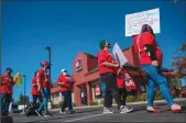  ?? HECTOR AMEZCUA/SACRAMENTO BEE ?? Workers and supporters march on Oct. 15, 2021, at a Jack in the Box restaurant in Folsom, where they say management threatened to call immigratio­n enforcemen­t after the employees made complaints about wage theft, a lack of meal or rest breaks, and safety issues related to COVID-19.