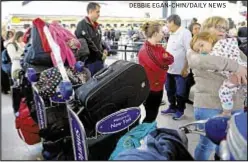  ?? DEBBIE EGAN-CHIN/DAILY NEWS ?? Stranded passengers at Kennedy Airport, victims of wicked weather and a water main break, wait and wonder Sunday when they’ll get on a flight.