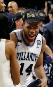  ?? ERIC GAY — THE ASSOCIATED PRESS ?? Villanova forward Omari Spellman celebrates on the court after beating Michigan 79-62 in the championsh­ip game of the Final Four NCAA college basketball tournament, Monday in San Antonio.