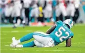  ?? JIM RASSOL/STAFF PHOTOGRAPH­ER ?? Rookie linebacker Raekwon McMillan is attended to after injuring himself on his first play in the NFL.