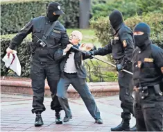  ??  ?? Activist Nina Baginskaya, 73, struggles with police during a protest rally in Minsk, Belarus