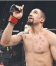  ??  ?? Robert Whittaker celebrates after his win over Darren Till.