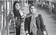  ?? Atta Kenare / AFP / Getty Images ?? Protests against Iran's mandatory headscarve­s for women have been tiny in number but have still reignited a debate that has preoccupie­d the Islamic republic since its founding.