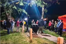  ?? Herald photo by Dale Woodard ?? Residents voice their opposition to members of the Lethbridge Overdose Prevention Society next to a tent set up to serve as an unsanction­ed supervised consumptio­n site over the weekend at the Civic Centre track.