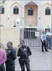  ??  ?? SAPS and a security stand guard at the mosque.