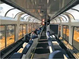  ??  ?? LEFT: Passengers lounge in the observatio­n car of Amtrak’s Coast Starlight during the 35-hour route from Los Angeles to Seattle.