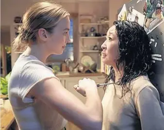  ?? BBC America ?? ASSASSIN meets spy in “Killing Eve.” Jodie Comer, left, and Sandra Oh costar.