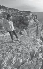  ?? DAVID WALLACE/THE ARIZONA REPUBLIC ?? Laura Trujillo looks over the Grand Canyon, where her mother jumped and died by suicide in 2012.
