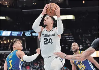  ?? ASSOCIATED PRESS FILE PHOTO ?? The Memphis Grizzlies’ Dillon Brooks, centre, a Mississaug­a native, is posting career-high averages in points (13.7), rebounds (3.7) and assists (2.1) so far in his third NBA season.